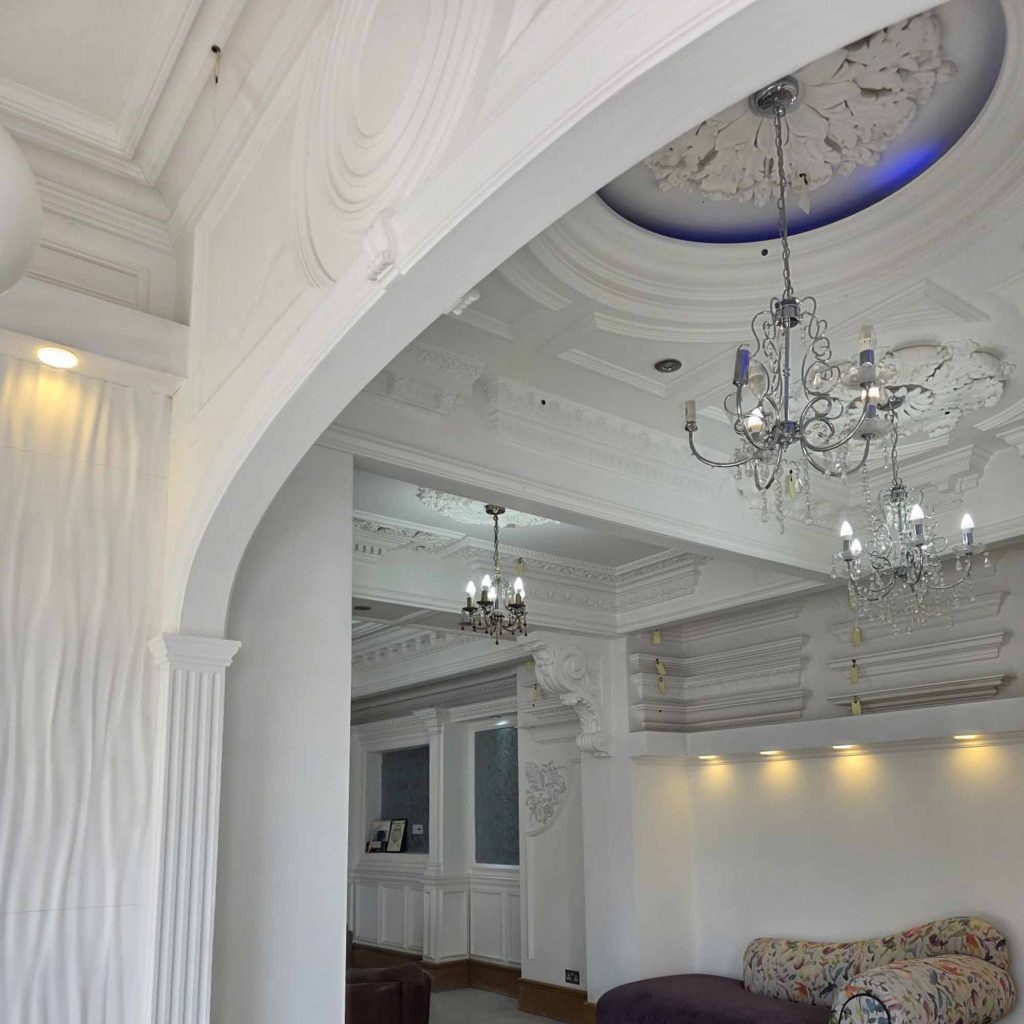 Luxury semi-elliptical plaster archway with fluted pilasters and decorative plaster mouldings