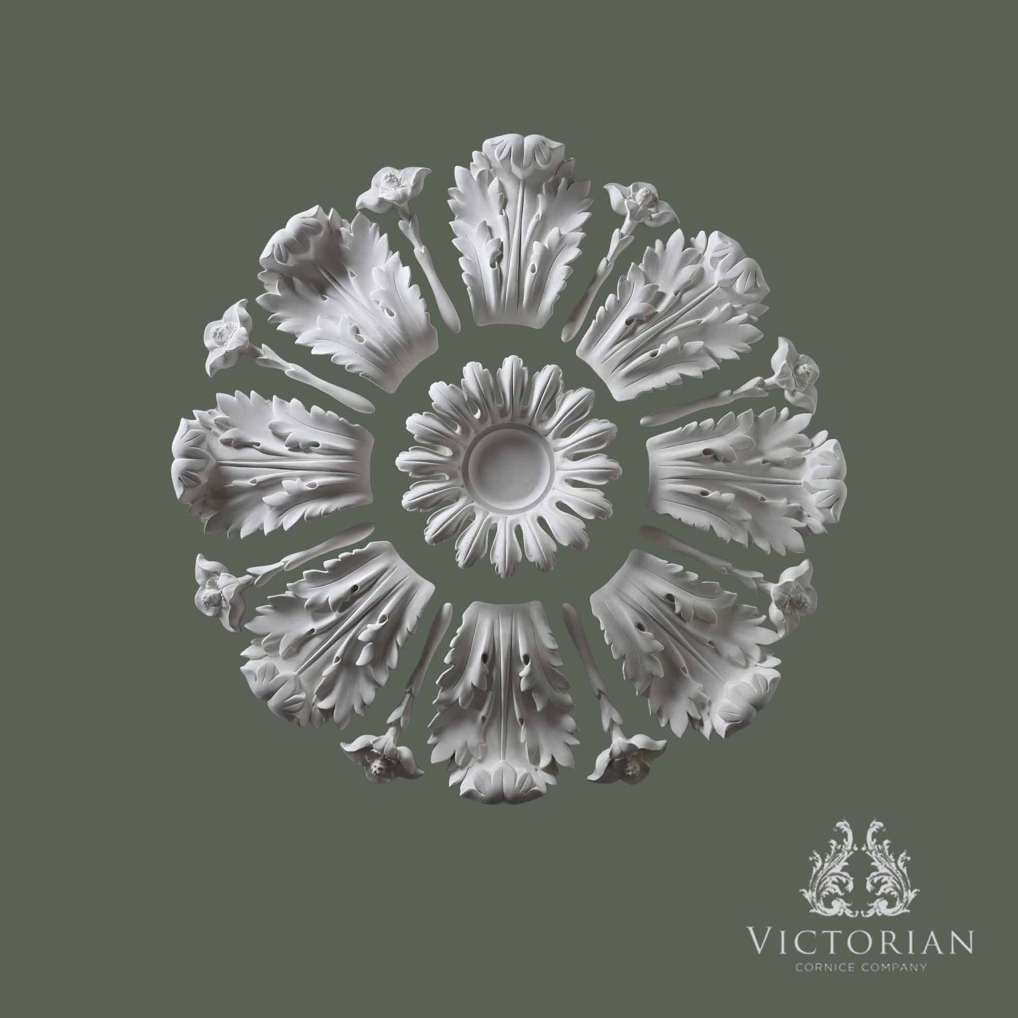 R42 800mm multi-piece plaster ceiling rose shown as individual cast sections ready for installation.