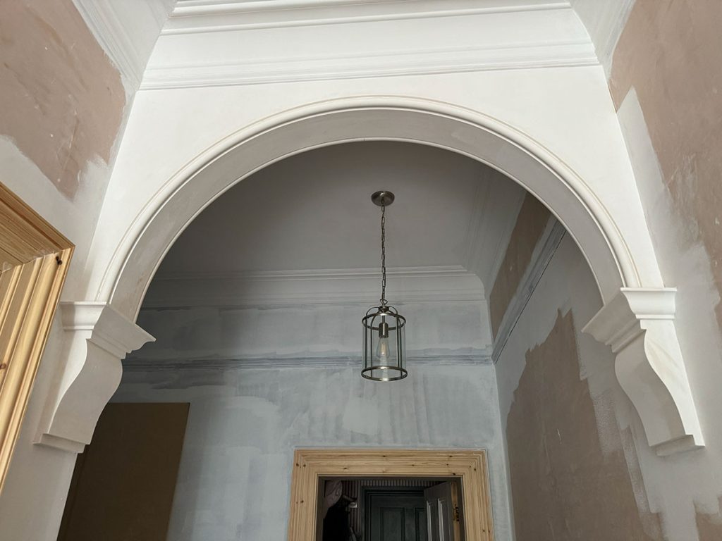 Bespoke plaster arch with decorative corbels installed in a residential property in York