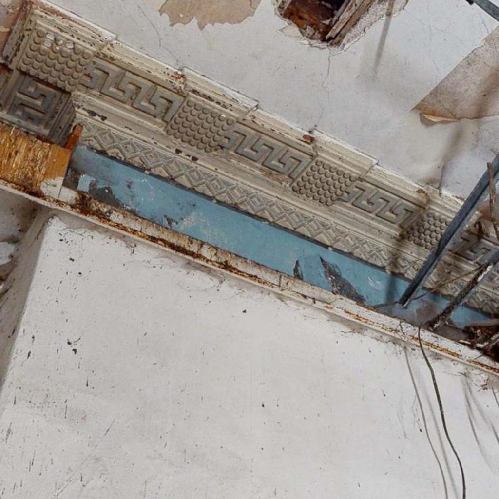 Original decorative plaster cornice at Worswick Chambers in Newcastle before restoration