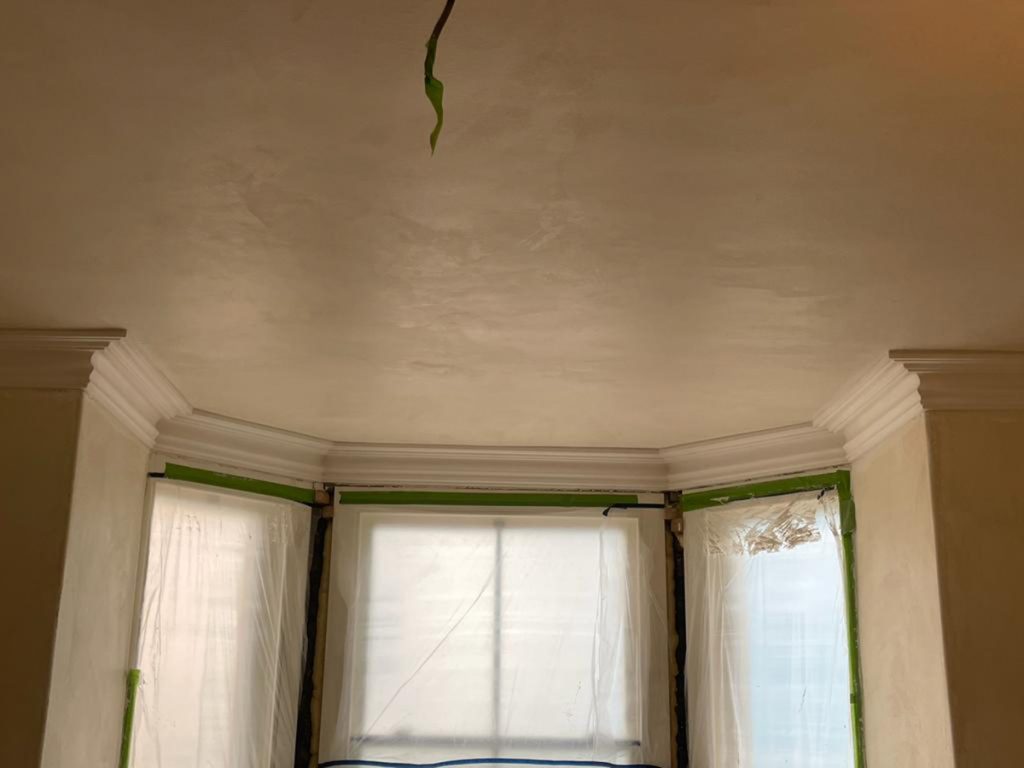 Plaster cornice installed around a bay window in a York living room