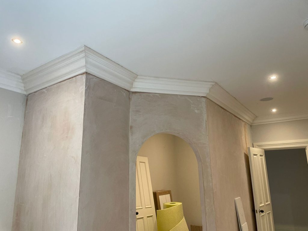 Traditional plaster cornice installed around projecting walls in a York lounge