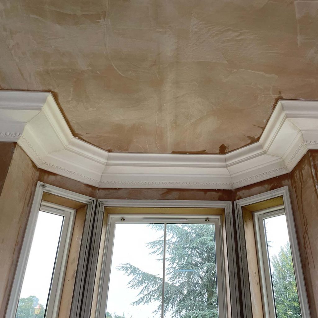 Plaster cornice installed around a bay window in Cheltenham before the modillion blocks were added