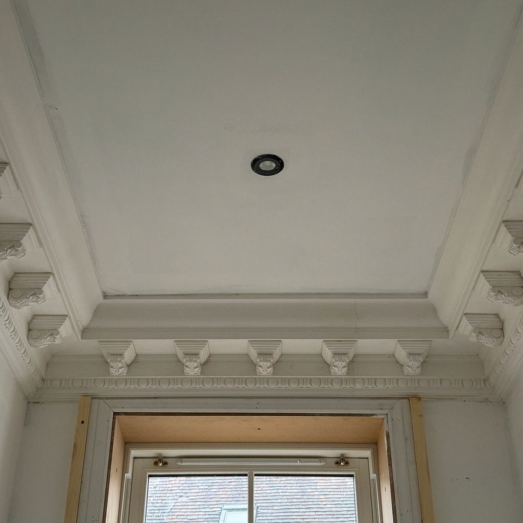 Decorative plaster cornice installed in the spice cupboard of a Cobham property